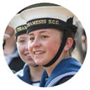 A smiling girl Sea Cadet with her friend in uniform